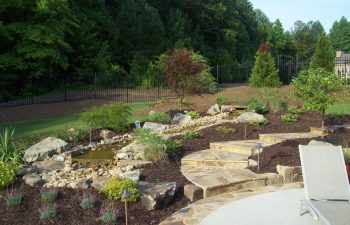 garden flagstone patio and walkway by Mobile Joe's Landscaping