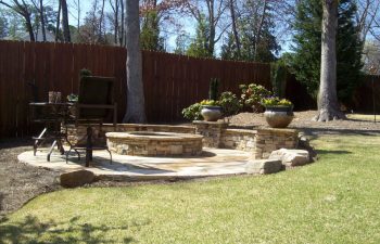 garden flagstone patio with a fire pit