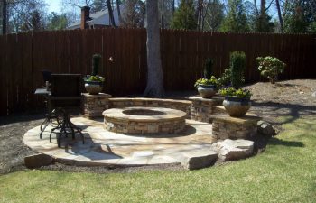 garden flagstone patio with a fire pit
