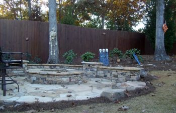fall garden flagstone patio with a fire pit