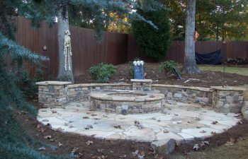 fall garden flagstone patio with a fire pit